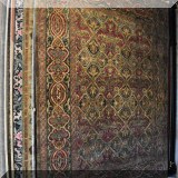 R68. Handcrafted wool rug with Celtic knot design.